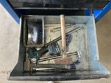 a tool box with tools inside of it on the floor
