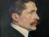 portrait of a man with a mustache in a suit and tie