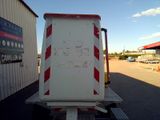 a white truck with a red and white stripe on the back