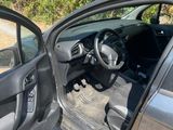 a car that has its door open on the side of the road