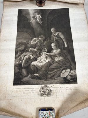 un vieux parchemin sur lequel figure une crèche