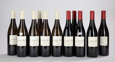 six bottles of wine lined up in a row on a table