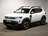 Le petit SUV blanc est garé dans une grande pièce.