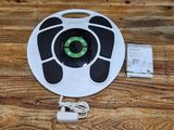 an image of a white and green robotic vacuum cleaner