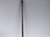 an old cane with a wooden handle on a white surface