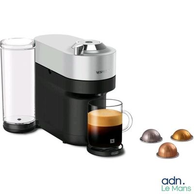 a close up of a coffee maker with a cup of coffee