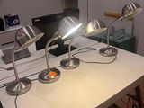 three lamps that are on a table in a room
