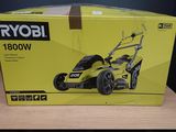 a box of a lawn mower sitting on top of a wooden table