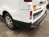 a white van that is parked in a parking lot