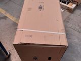 a large cardboard box sitting on the floor in a warehouse