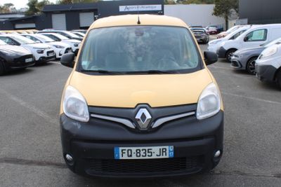 a small yellow van parked in a parking lot