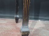a close up of a table with a clock on top of it