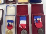 many medals and medals displayed on display on a table