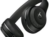 the beats on ear headphones are black and have a built - in microphone