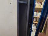 an image of a room with a shelf and a toilet