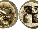 une pièce d'argent avec une croix au recto et un visage au verso