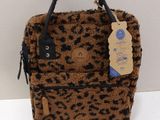 leopard print handbag with black handles and a tag on it