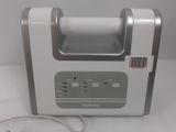 a silver and white machine with a barcode on it