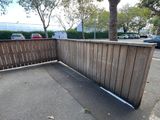 a wooden fence with a white line on it