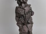 statue of a man with a helmet and a book in his hands