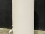 an image of a white water heater sitting on top of a cement floor