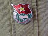 a badge on the back of a man ' s jacket