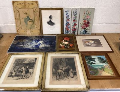 many framed pictures on a table with pictures on it