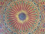 the ceiling of a building with a circular design painted on it