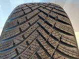 a close up of a tire on a white surface