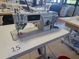 a sewing machine sitting on a table in a room