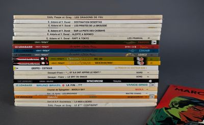 a lot of comic books stacked on top of each other