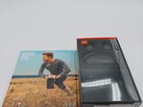 a close up of a cell phone sitting on top of a box