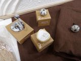 three boxes that are sitting on a bed next to each other