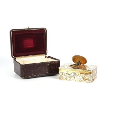 a small box with a ring in it and a small box with a ring in it