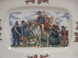 a plate with a picture of a group of people on it