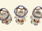 three pieces of glass sitting on top of each other