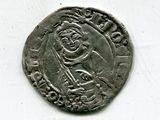 une vieille pièce d'argent sur laquelle figure l'effigie d'un homme