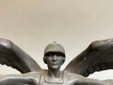 statue of a woman with wings and a helmet on her head