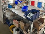 many boxes and bins on a workbench in a garage
