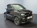 a picture of a small black car in a showroom