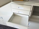 a file cabinet with a drawer in the middle of it