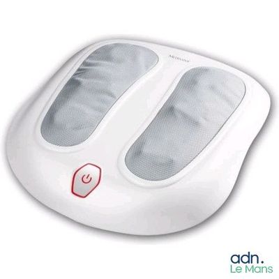 un gros plan d'un appareil de massage des pieds posé sur une surface blanche