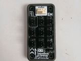 a close up of a remote control on a table