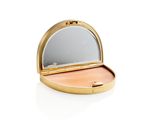 a close up of a compact mirror on a white surface