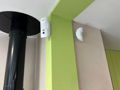 an image of a black and white stove in a green room