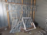 several pieces of metal are stacked up in a garage