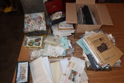a table with a lot of books and papers on it