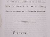 an old book with a black and white image of a man ' s face