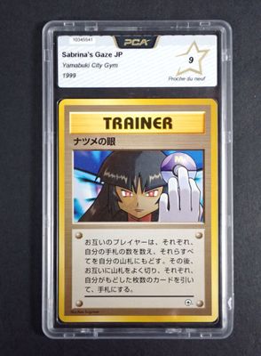 a close up of a card in a plastic case on a table