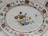 a plate with a floral design on it on a table